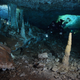 A diver exploring the submerged cave.